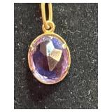 gold-tone chain necklace with a faceted,