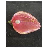 This pink calla lily brooch matches the signature