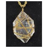 gold-toned wire-wrapped clear quartz crystal