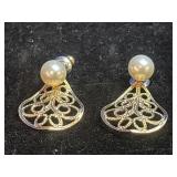 One pair of fashion earrings.