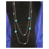 long, layered silver-tone serpentine chain