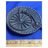vintage round metal belt buckle features a