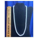 classic long white beaded necklace
