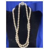 double-strand faux pearl necklace featuring a