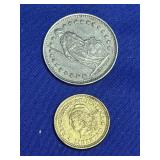1 Swiss franc coin and a 10 centavo , likely a