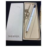 white and gold Sheaffer White Linen ballpoint pen