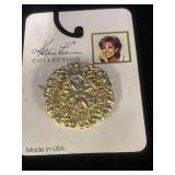 round, gold-tone filigree accessory piece from
