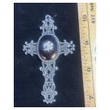 ornate, filigree-style silver-tone metal cross