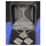 silver-tone necklace and matching square earrings