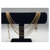 Vtg Monet gold tone 10 strand draperie necklace.