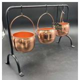 Hanging copper cauldrons