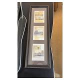 framed vertical wall art depictingarchitectural