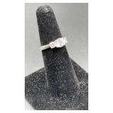 Silver tone ring w/ 3cz stones. Size 6