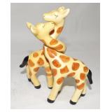Tall Giraffes with Entwined Necks