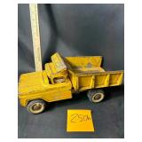 Vintage Nylint pressed steel dump truck in yellow