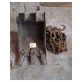 Mini excavator & heavy rusted rigging chains.