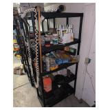 Plastic utility shelf with contents, tools, caulk