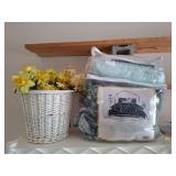 Comforter set in basket of flowers