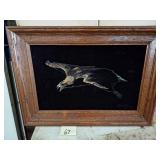 velvet painting of a golden eagle in flight,