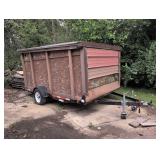 single-axle utility trailer with wooden shed