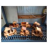 Collection of handcrafted wooden toy vehicles