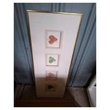 Vertical gold-framed wall art
