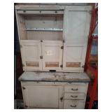 Antique appears Hoosier-style cabinet.