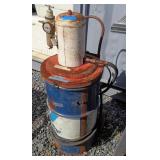 Air Grease Gun in Valvoline 25 gallon Can