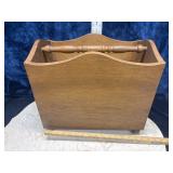 This is a vintage wooden magazine rack