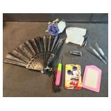 ID holders, tweezers, fan, needlepoint tool,