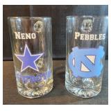 Large glass beer mugs with stickers on them