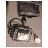 Blood pressure cuff in a closeable pouch.