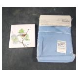 Handpainted tile coaster bird.  Blue pillowcases