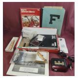 Alarm clock, fish keychain, bird book and
