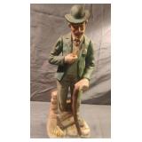 Vintage porcelain businessman statue. 13"