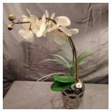 Orchid floral decor in a metal silver vase Orchid floral decor in a metal silver vase