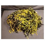 3 small black and yellow pom poms 3 small black and yellow pom poms