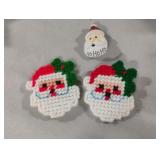 Santa Claus magnets and a pin