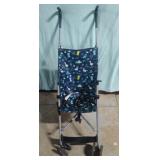 Childs stroller with dinosaur design