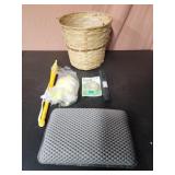 Bathtub pillow, swiffer duster, flashlight, trash