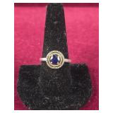 .925 14k plated ring with Blue center stone and