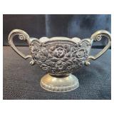 Vintage silver-plated sugar bowl with a white
