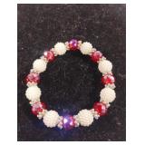 Beaded orangish-pinkish stretch bracelet