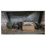 Bottom shelf assorted contents, parts, radio