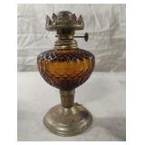 Vintage amber colored oil lamp