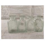 Vintage green tint medicine bottles