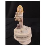 Vintage porcelain musical figurine from the