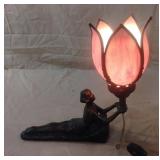 Small bronze and slag glass lamp of woman holding