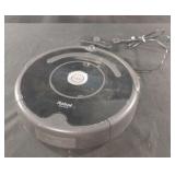 Robot Roomba with charger. Powers on
