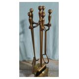 Metal fireplace tools on stand